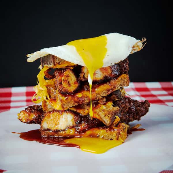 Fried chicken grill cheese sandwich with a sunny side up egg