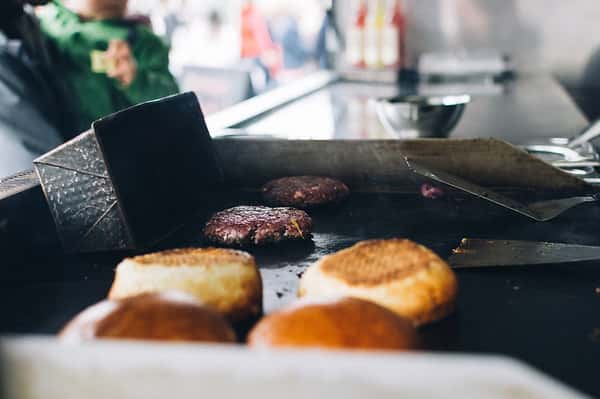 burgers and buns on grill