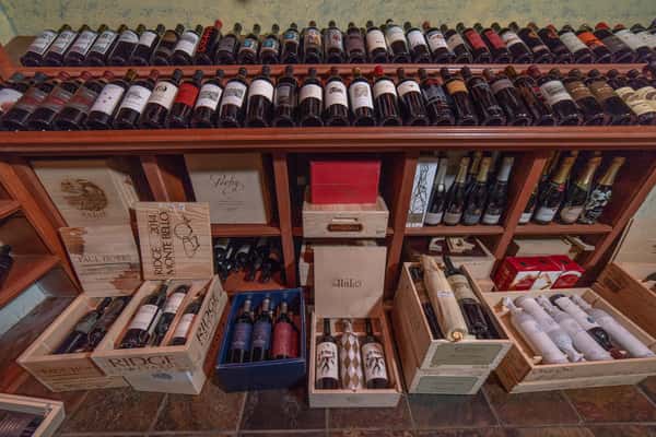 wine bottles in boxes and on shelf