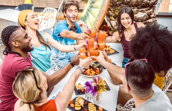 diverse-people-friends-hanging-out-toasting-drinking-cocktails-outdoor