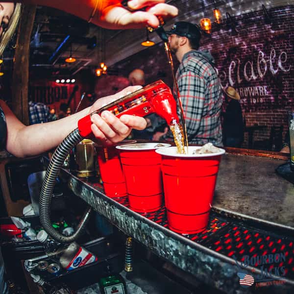 Tap being poured into red solo cups
