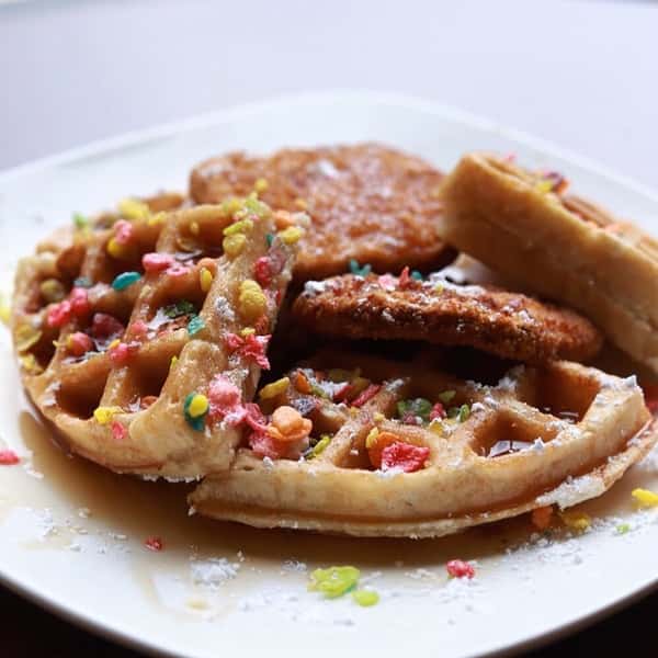 Vegetarian Waffle infused with colorful Fruity Pebbles, Crispy Fried Chicken and warm syrup. Breakfast will never be the same again!
