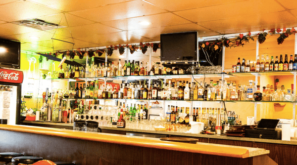 Clementina behind the bar