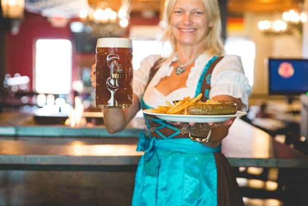 waitress with sausage and beer