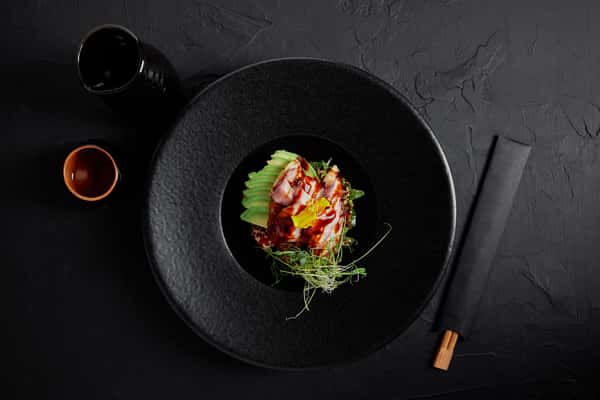 Avocado & Ham Tartare: Thinly sliced avocado, ham, herbs with soy glaze.