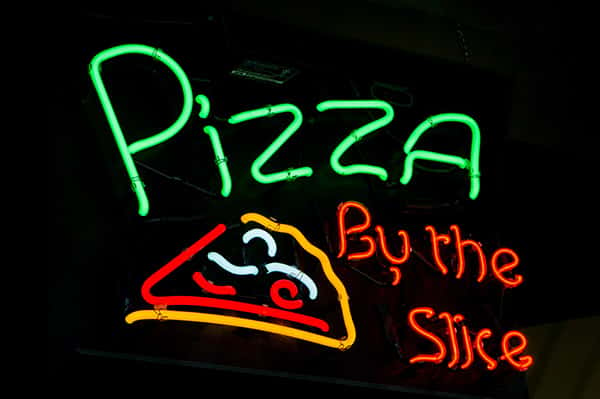 pizza by the slice sign