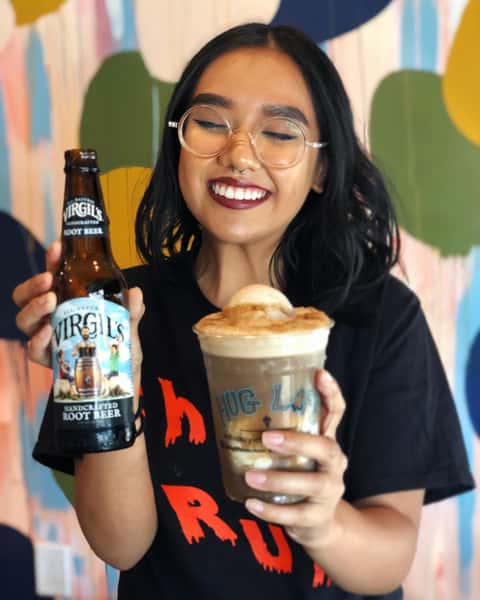 Woman enjoying a Virgil's root beer float