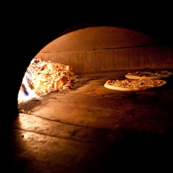 wood fired oven with pizza