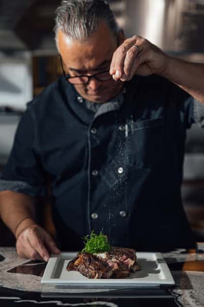 chef salting food