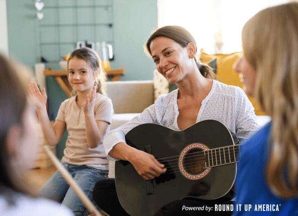 woman playing guitar