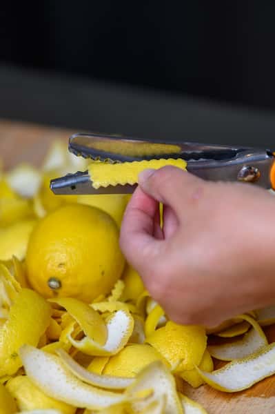 bartender prepping lemon twists