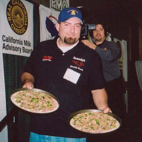 guy holding two pies