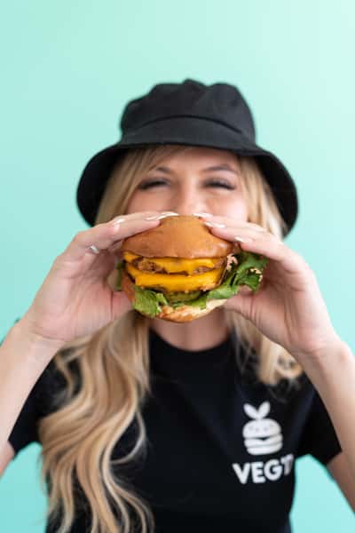 girl holding veggie burger