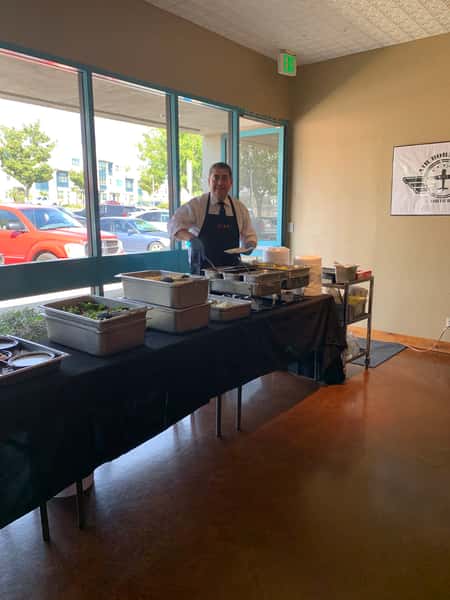 Server preparing to serve at a catered event
