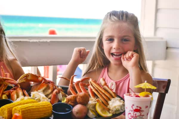 Little Girl Eating Crab Legs