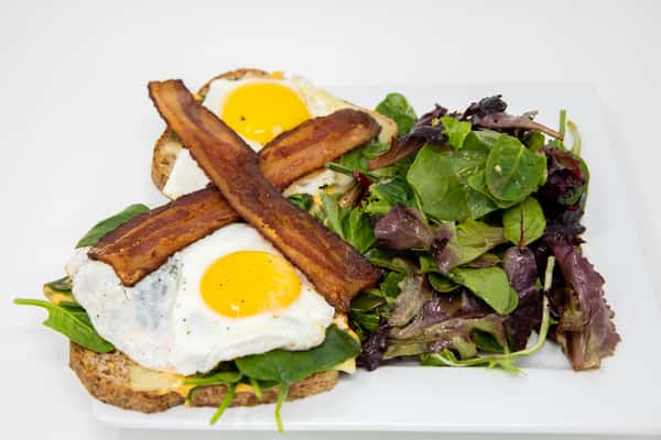 Fried egg sandwich with greens
