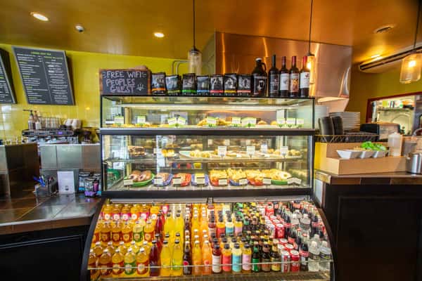 Self service counter with a variety of drinks and treats