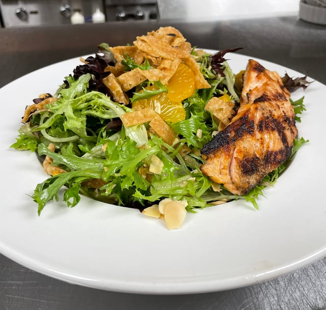 Charbonos - Light, fresh, and full of flavor! Our Capri Salmon salad is a  filling salad option on our menu for lunch and dinner.